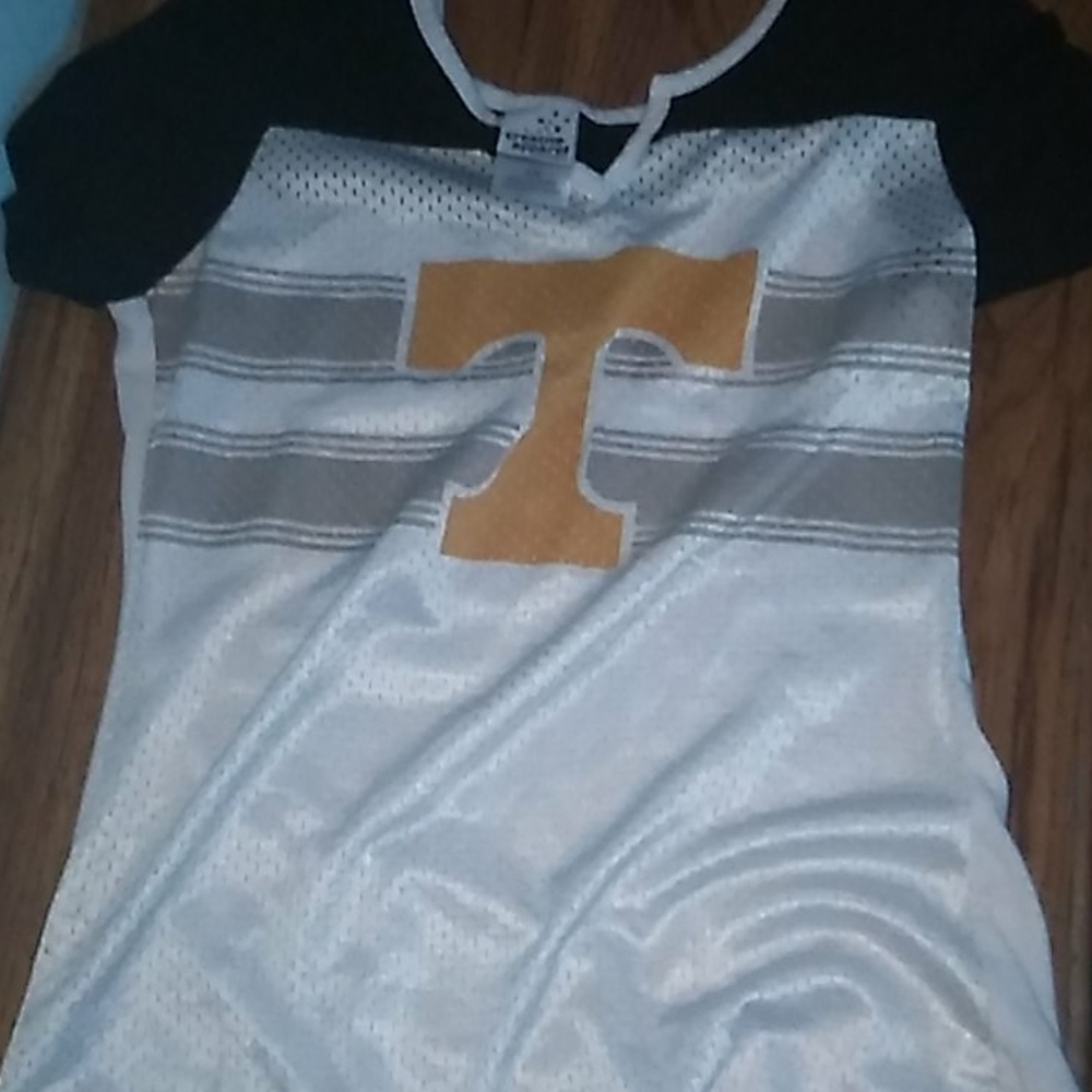 Size s/p white orange and black shirt.